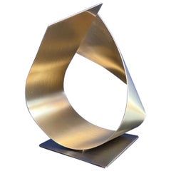 Brushed brass sculpture with bronze base 