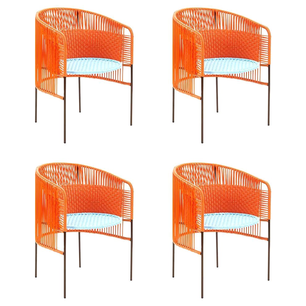 Satz von 4 orangefarbenen Caribe-Esszimmerstühlen von Sebastian Herkner im Angebot