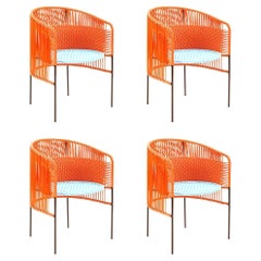 Ensemble de 4 chaises de salle à manger Caribe orange menthe de Sebastian Herkner