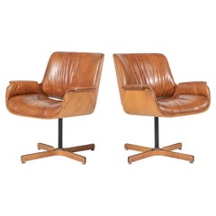 One Mid-Century Modern Swivel Faux Leather and Wood Armchair by Plycraft
