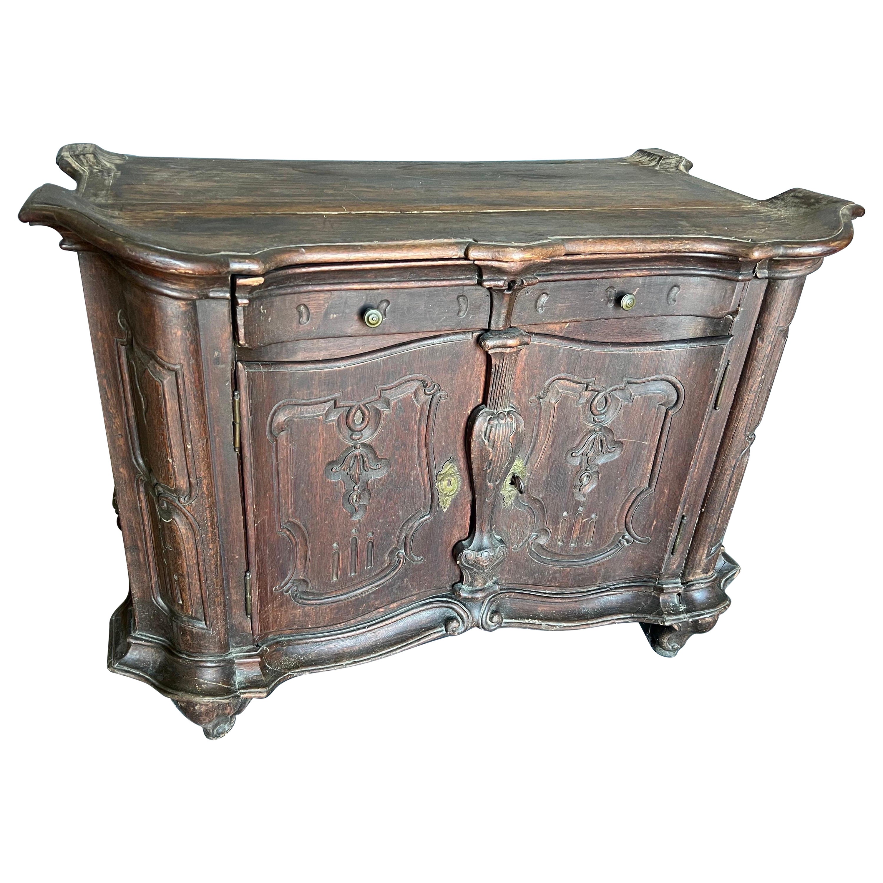 Early 18th Century Portuguese Rococo Cabinet with Shaped Top For Sale