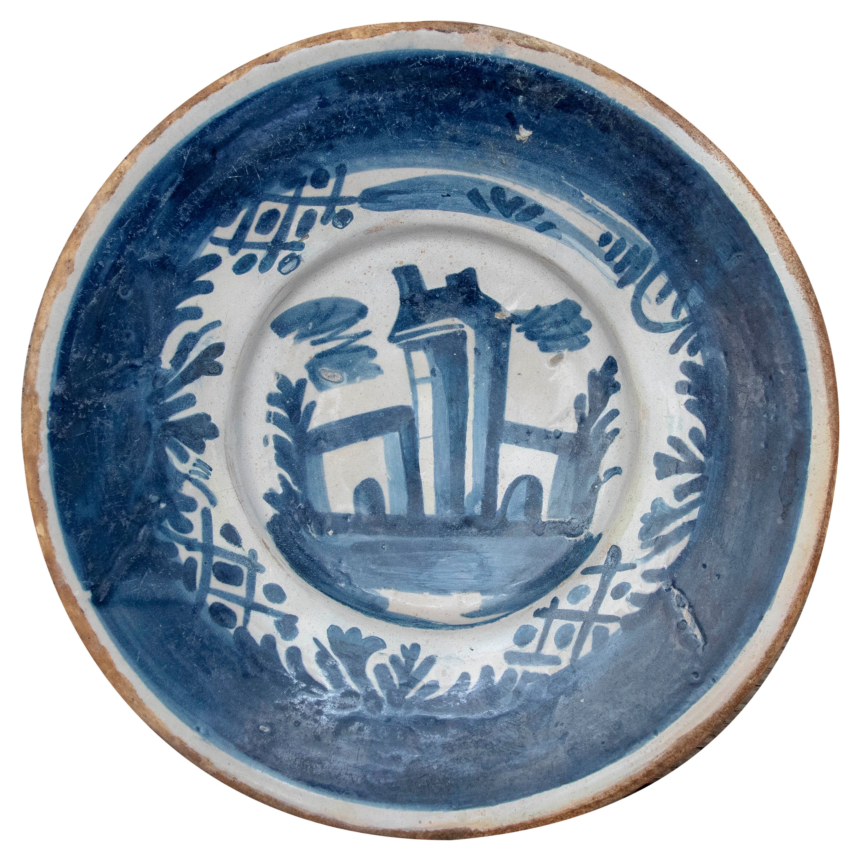 Piatto in ceramica spagnola del XVIII secolo con scena architettonica