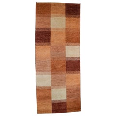 Milford, Sweden, pure wool rug. Geometric fields in red, orange and white shades
