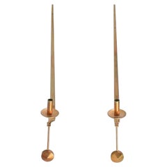 Skultuna, Sweden. A pair of brass candlesticks for wall hanging. 