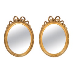 Antique 19th Century French Pair of Oval Gold Gilt Mirrors with Bow Tied Ribbon