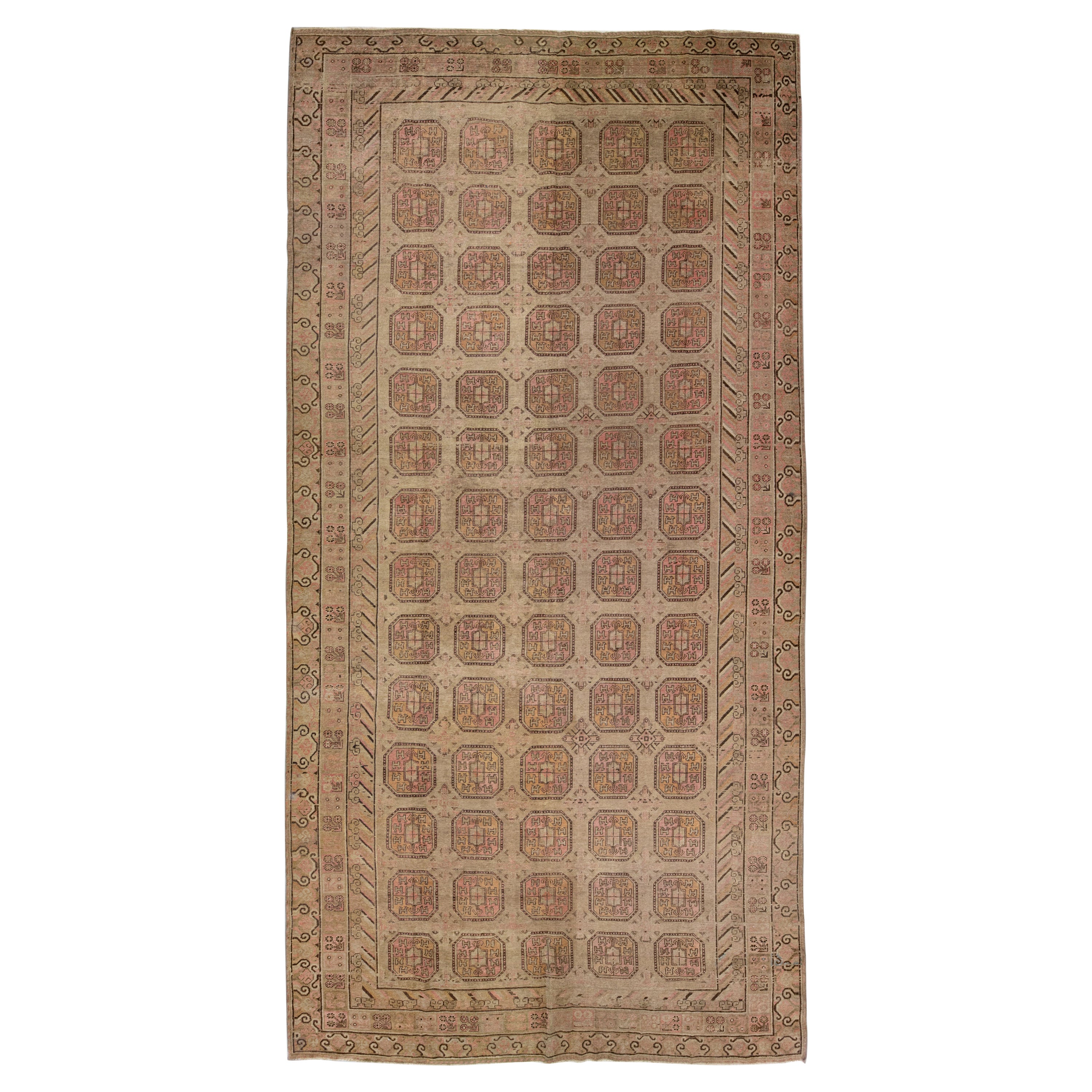 1900s Antique Brown Handmade Khotan Wool Rug with Geometric Pattern
