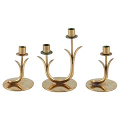 Gunnar Ander for Ystad Metall. Three brass candlesticks. 1950s.
