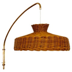 Adjustable arc wall lamp with wicker lampshade