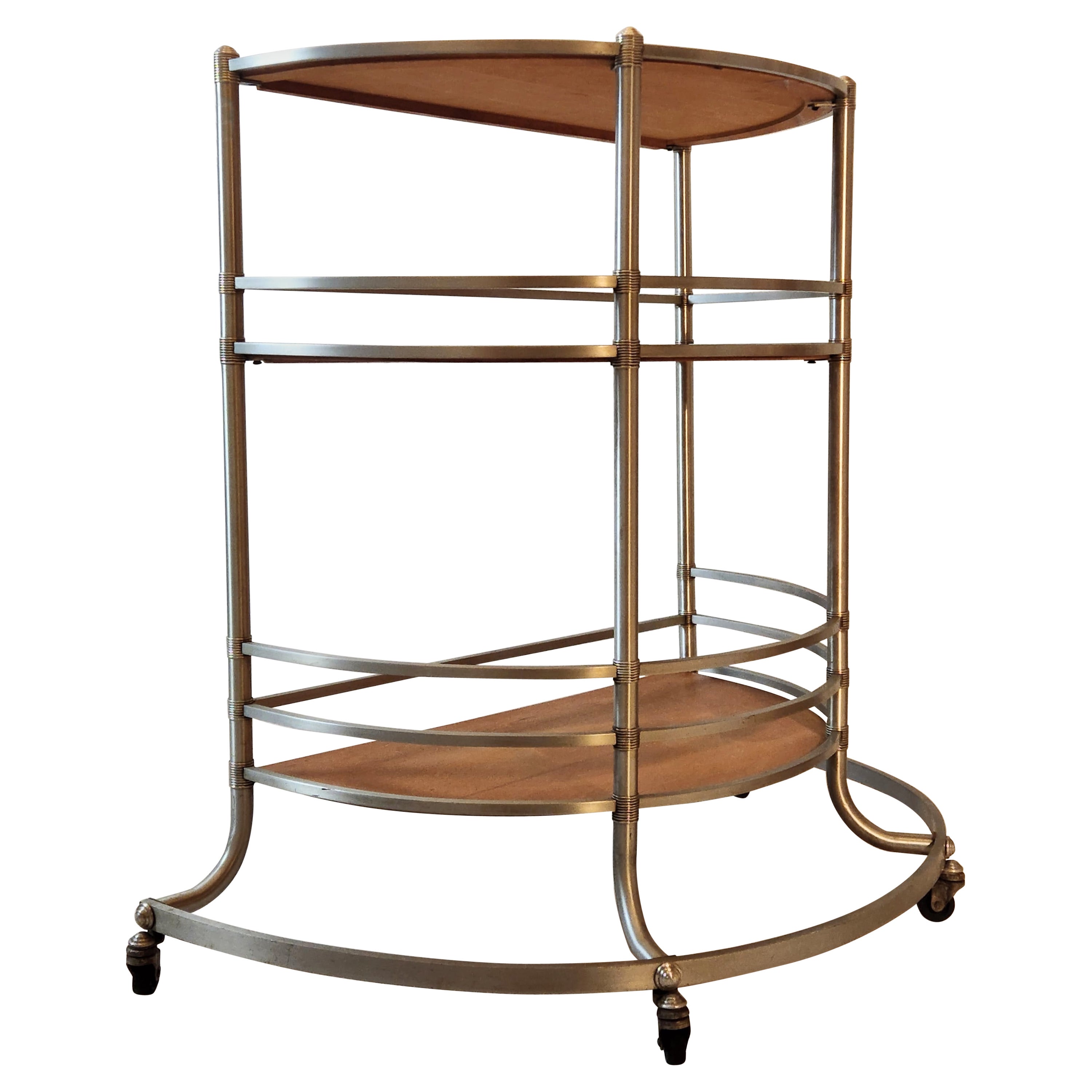 A Warren McArthur modernist rolling bar cart manufactured during the first years Warren was located in Rome, New York. 
The Warren McArthur Corporation moved from Los Angeles to Rome, New York in January of 1933.

The label ending in 