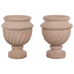 Pair of Carved Pink Stone Urns, 20th Century