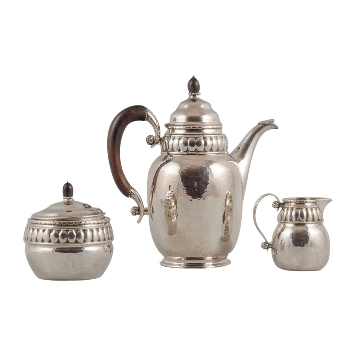 Rare Georg Jensen coffee pot with accompanying creamer and sugar bowl in silver