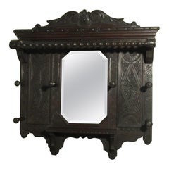 A Victorian Carved Oak Hall Mirror with Hat and Coat Hooks   