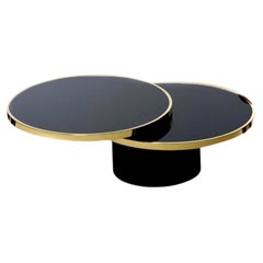 1970 Design Institute of America Table basse pivotante en verre noir et laiton