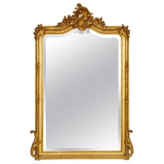 Large French Gilt Pier Mirror with Scroll Accents from the 19th Century