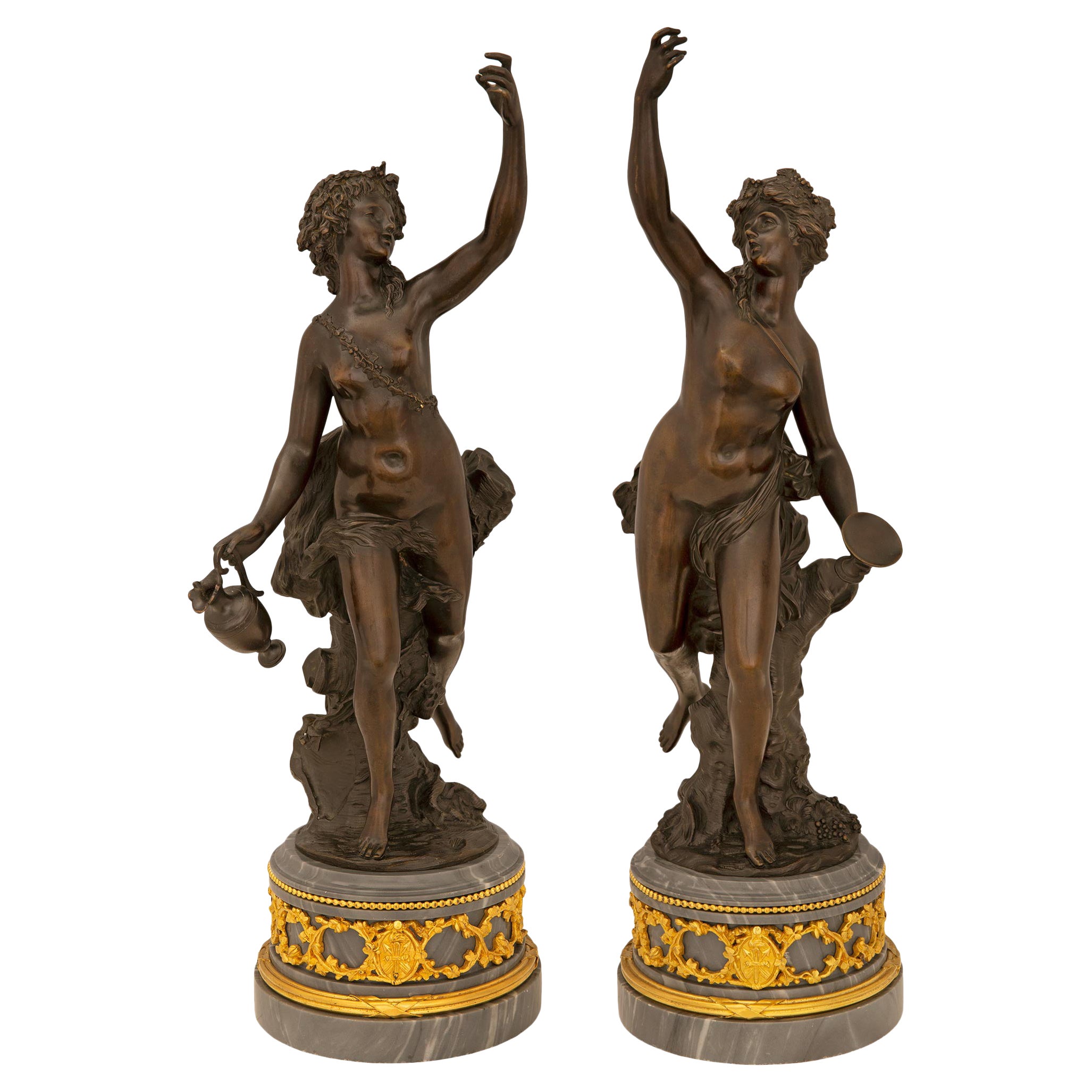 Paire de véritables statues de style Louis XVI du 19ème siècle en bronze, bronze doré et marbre