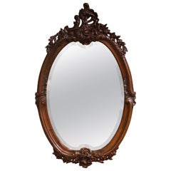 19th Century French Louis XV Hand Carved Walnut and Beveled Glass Oval Mirror