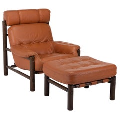 Fauteuil de salon et repose-pieds brutaliste en cuir cognac de Jean Gillon