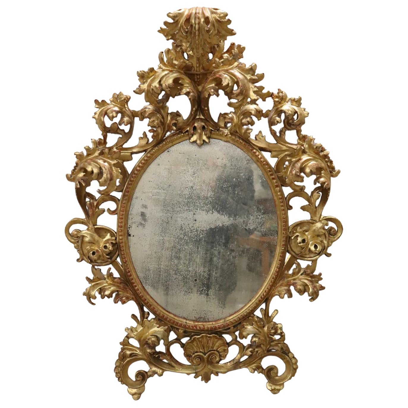 18th Century Italian Baroque Carved Gilded Wood Oval Wall Mirror For Sale