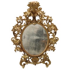 18th Century Italian Baroque Carved Gilded Wood Oval Wall Mirror