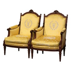 Antique Pair of 19th Century French Louis XVI Carved Walnut Winged Armchairs