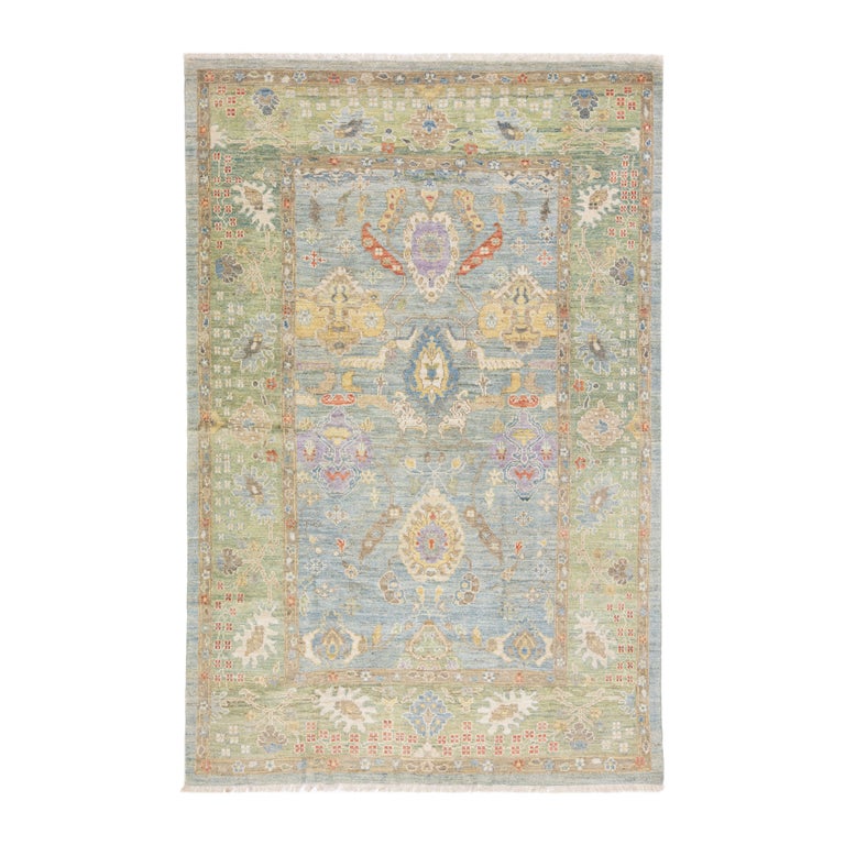 Handmade Modern Oushak Style Blue and Green Wool Rug with Floral Motif