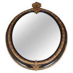 Late 19th century French mirror, Black painted frame with guilded stucco decor