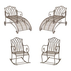 Vintage SUITE OF TWO IRON GARDEN CHAISE LOUNGES AND A PAiR OF ROCKING ARMCHAIRS