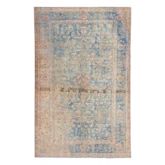 Tapis Sarouk Farahan ancien en laine persane bleue fait à la main avec motif floral