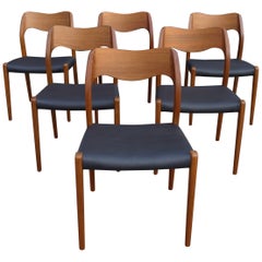 Six Niels. O Moller 71  teak dining chairs by J.L. Mollers in black leather