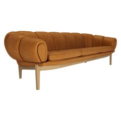 Leather 'Croissant' Sofa by Illum Wikkelsø for Gubi with Oak Legs