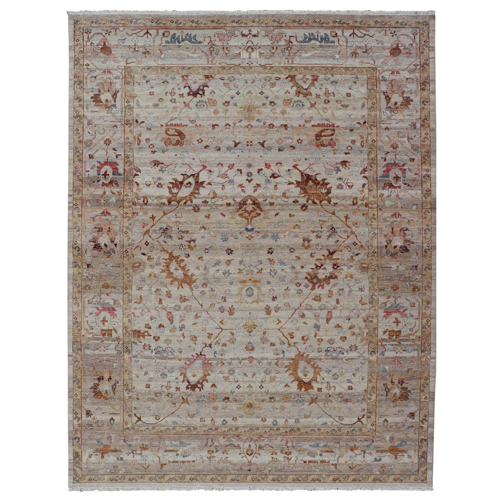 Modern Oushak Muted Rug in Earthy Tones on a Cream Background For Sale