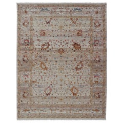 Modern Oushak Muted Rug in Earthy Tones on a Cream Background