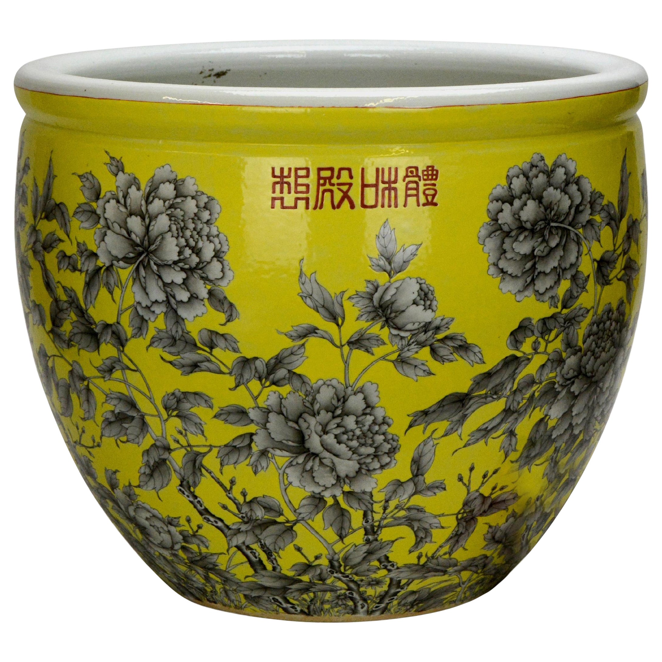 Grande jardinière chinoise Qing en porcelaine émaillée jaune à fleurs noires