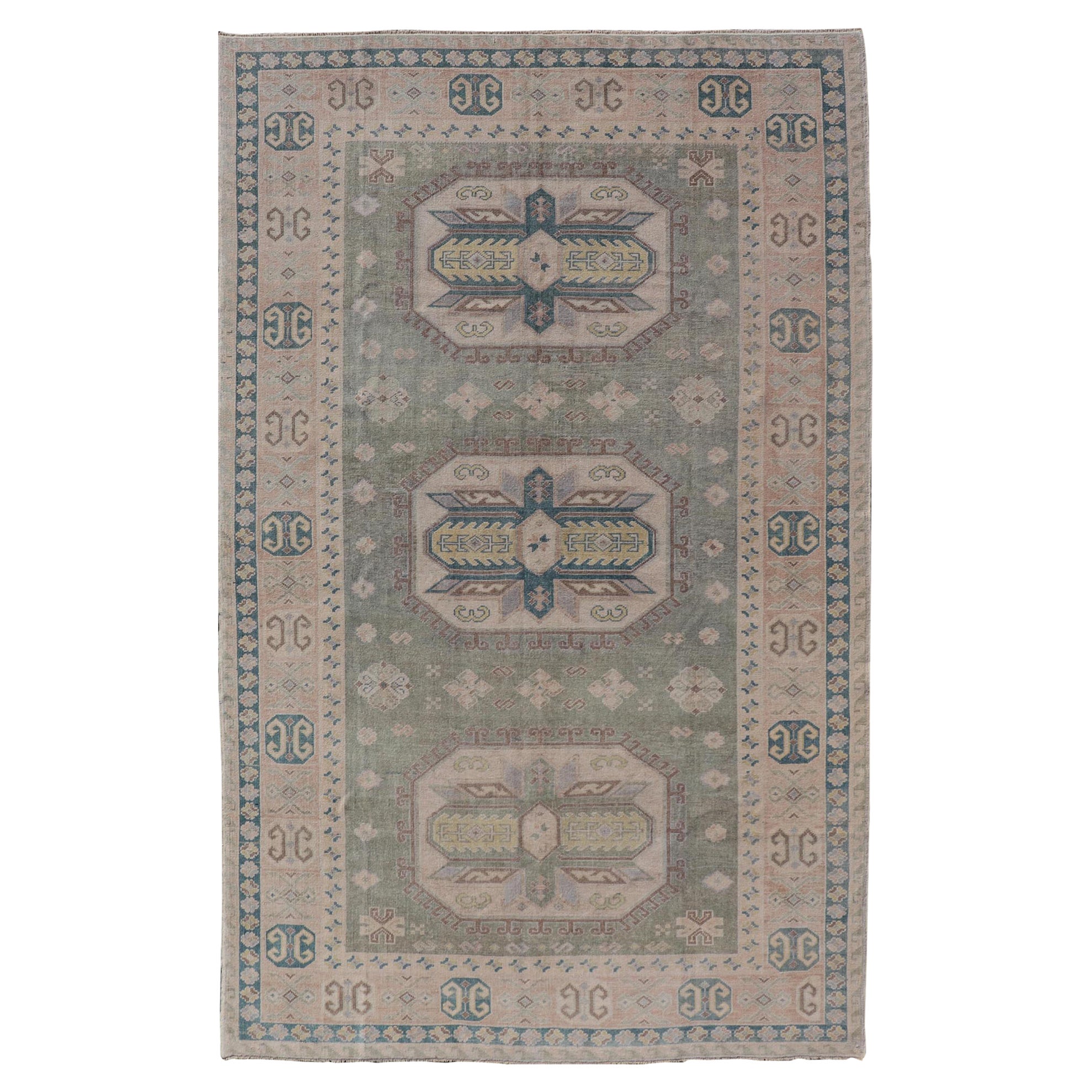 Turkish Vintage Tribal Medallion Oushak in Muted Green, Blue, and Cream For Sale