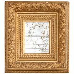 Specchio da parete in legno dorato intagliato in stile barocco italiano del XIX secolo
