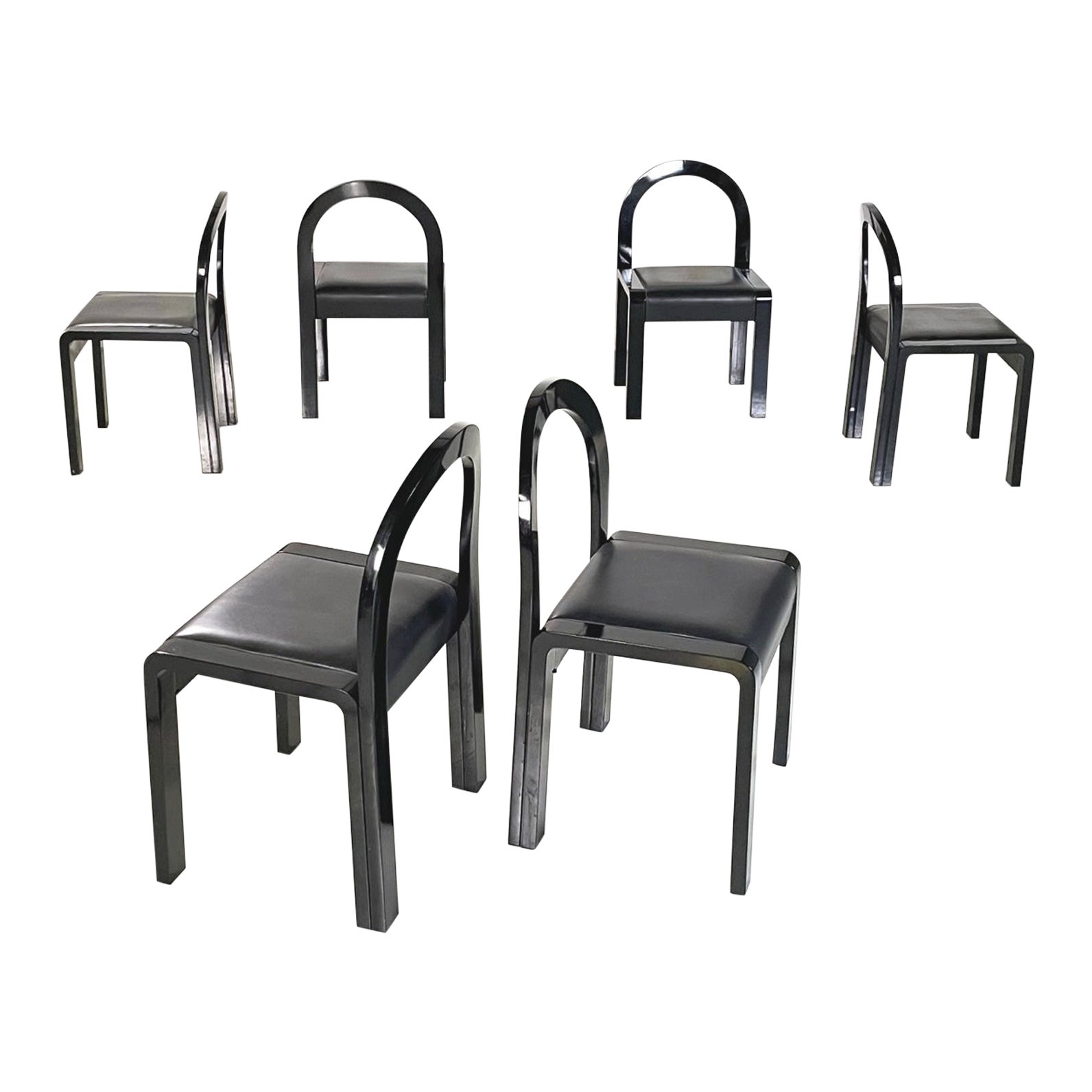 Italian modern Chairs in black lacquered wood and black leather, 1980s