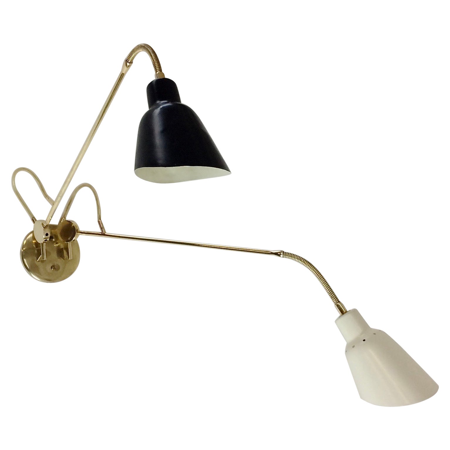 Rare original Angelo Lelli wall light for Arredoluce, circa 1952, Italy.
Structure in polished brass, two arms mounted on flexible tubes adjustable by pierced wheel on brass bolt.
Original label Arredoluce Monza, Made in Italy.
Dimensions: 75 cm L