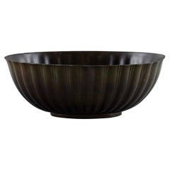 Just Andersen. Jardiniere of patinated disco metal with grooved body.