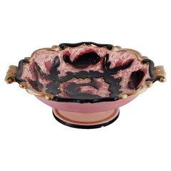 Vallauris, France. Ceramic bowl with fish motif in beautiful pink glaze.