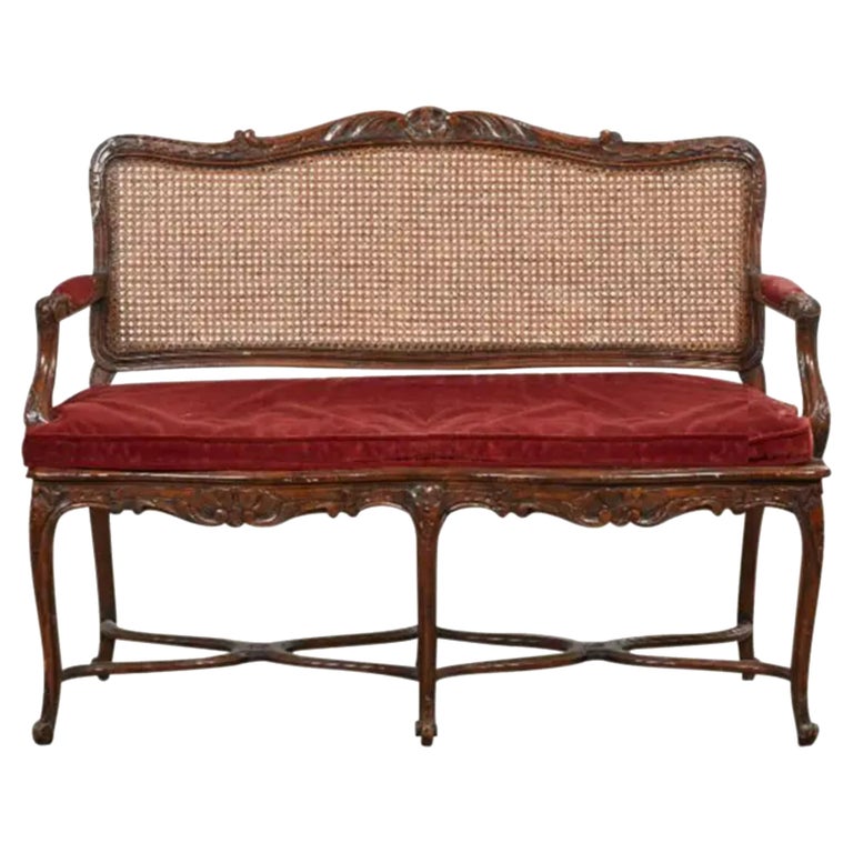 Louis XV Style French Provincial Carved Walnut and Cane Seat Settee For