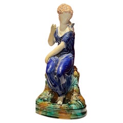 Antique Continental Majolica Pottery Figure of a Lady and Bird, 19th Century