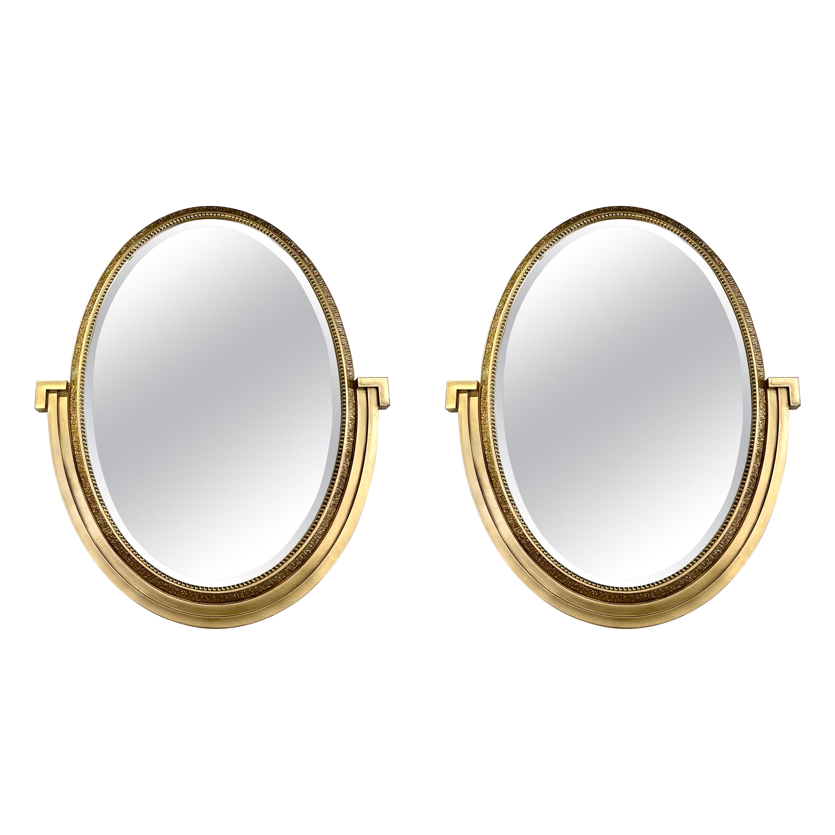 Pair of Neoclassical Gilded Wood Oval Mirrors For Sale
