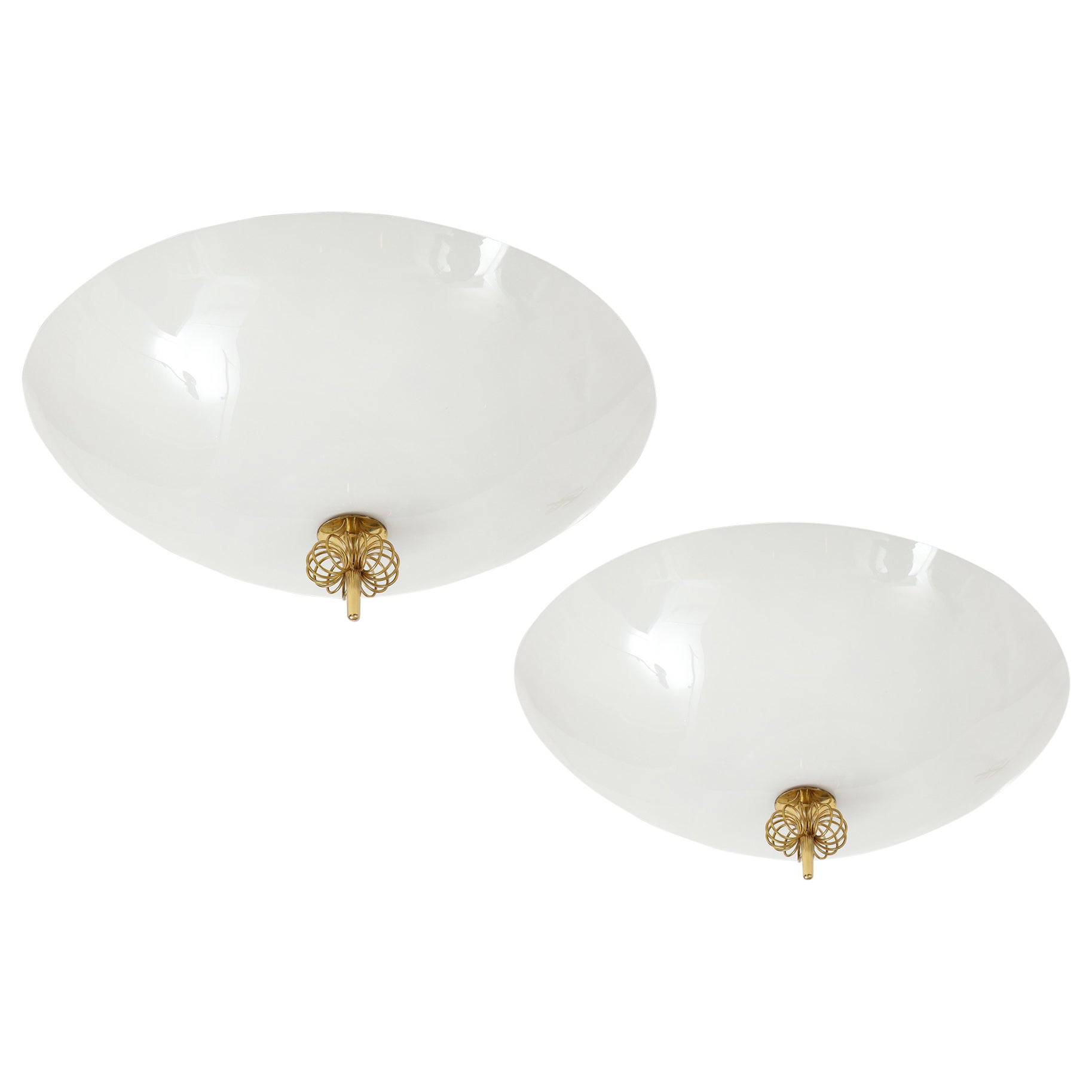 Paavo Tynell for Idman Oy rare and elegant flush mount ceiling lights with opaline glass dish shades with trademark central brass spiral decorations. Impressed with manufacturer's mark 