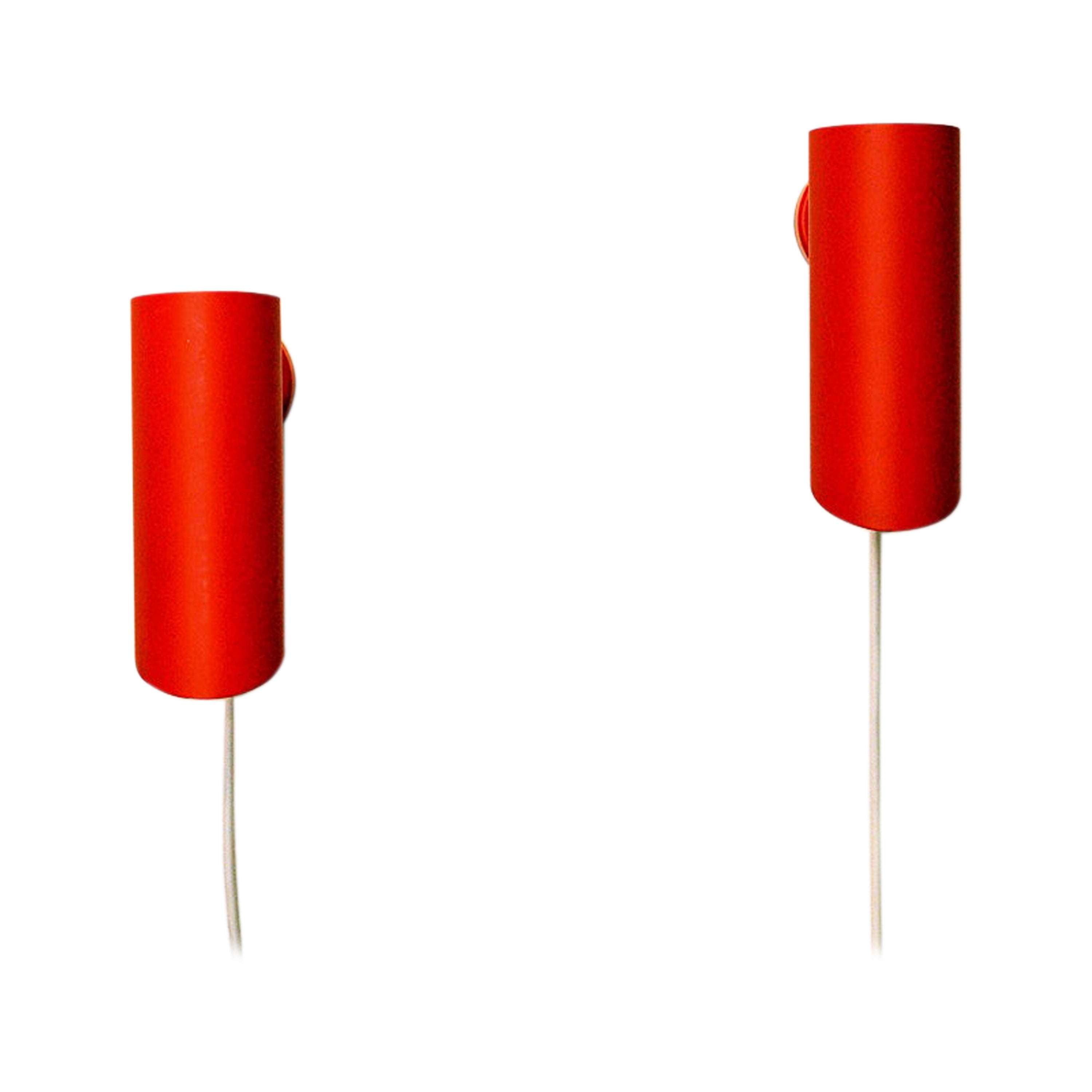Lovely orange colored metal pair of wall lamps made by Svend Middelboe for Nordisk Solar - Denmark in the 1960s. These decorative cylinder shaped wall lamps have a white inside and the light switch placed on the wall base. They are great as a pair