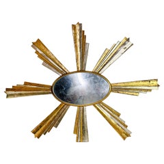 Espejo de pared ovalado con marco en forma de rayo de sol Giltwood