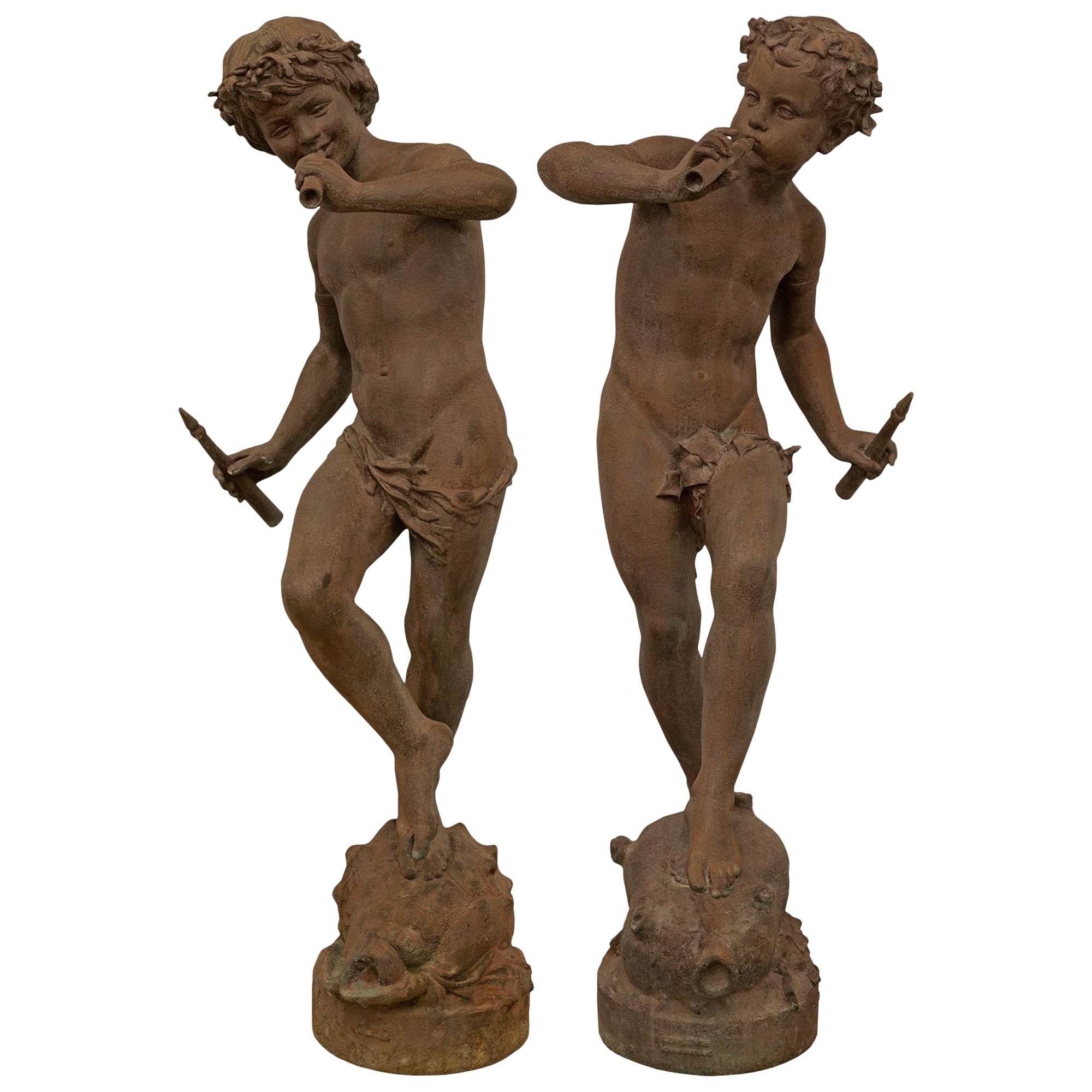 True Pair of French 19th Century Cast Iron Statues of Two Young Boys For Sale