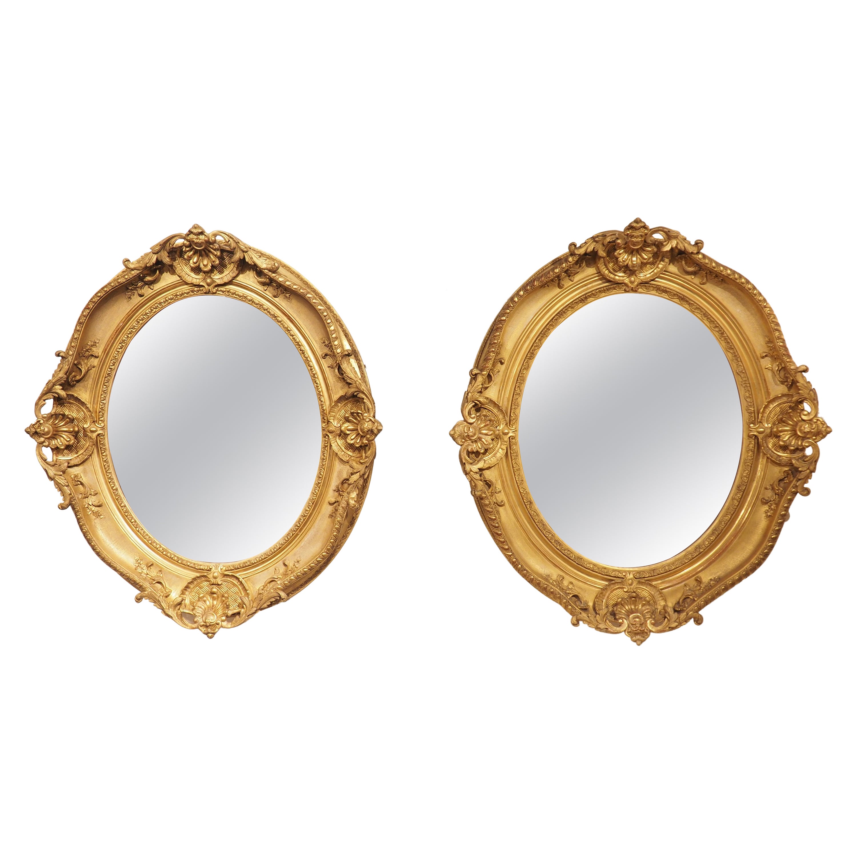 Pair of Large 19th Century Louis XV Style Oval Giltwood Mirrors from France