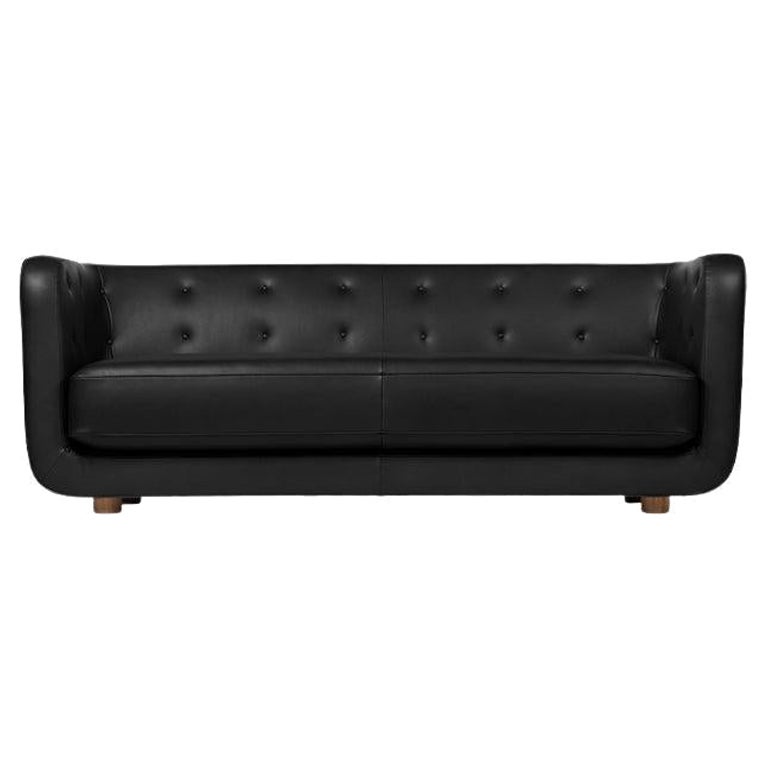 Vilhelm-Sofa aus schwarzem Leder und geräucherter Eiche von Lassen