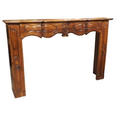 18th Century Carved Walnut Fireplace Mantel from Burgundy, France