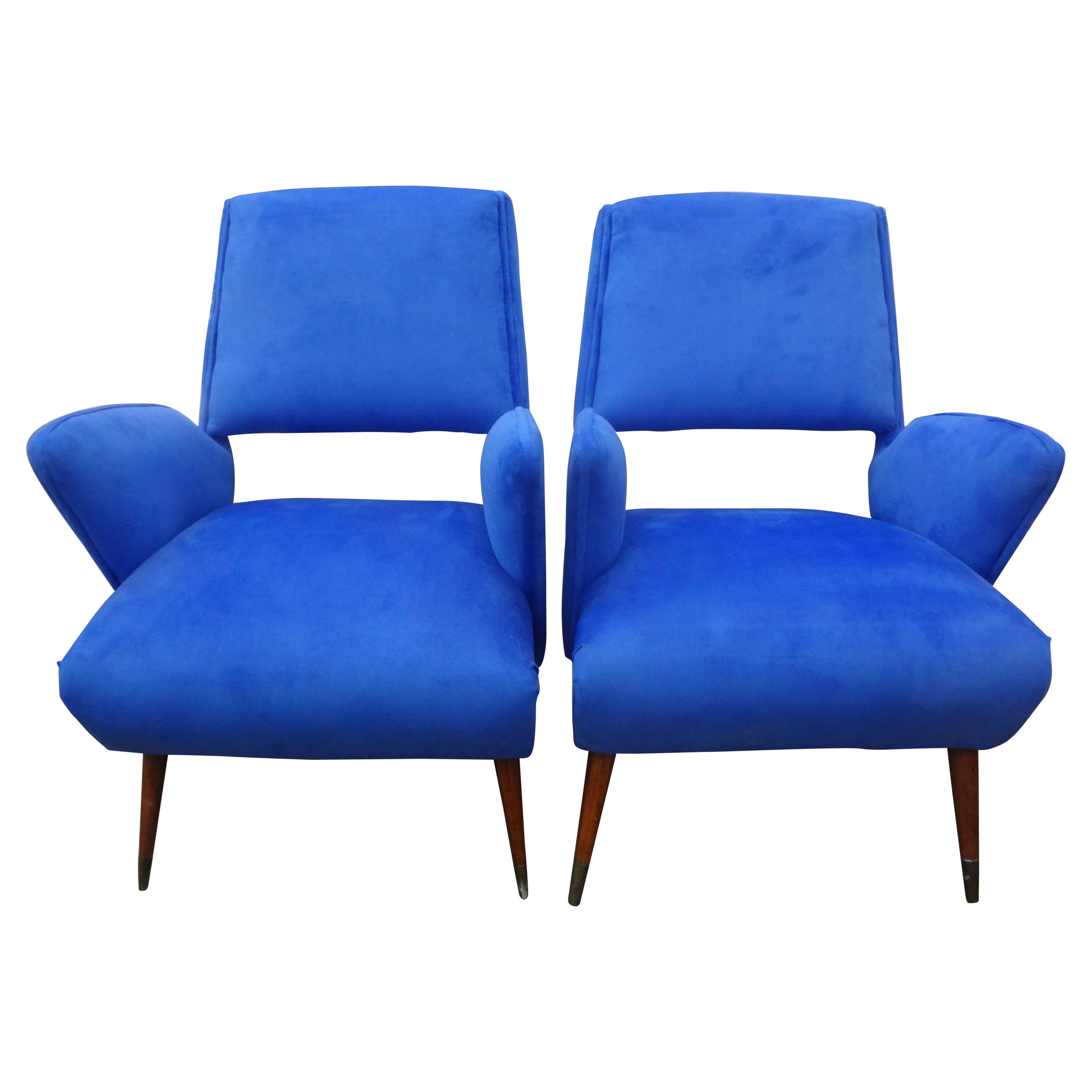 Near Pair of Italian Gio Ponti inspired lounge chairs.
This stunning complementary pair of Italian Mid-Century Modern lounge chairs, club chairs, or side chairs have beautifully tapered legs with brass sabots and an interesting open back. These